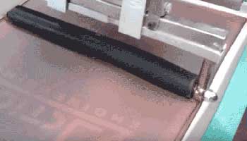 Using a roller squeegee to lay down fleece fluff and improve registration