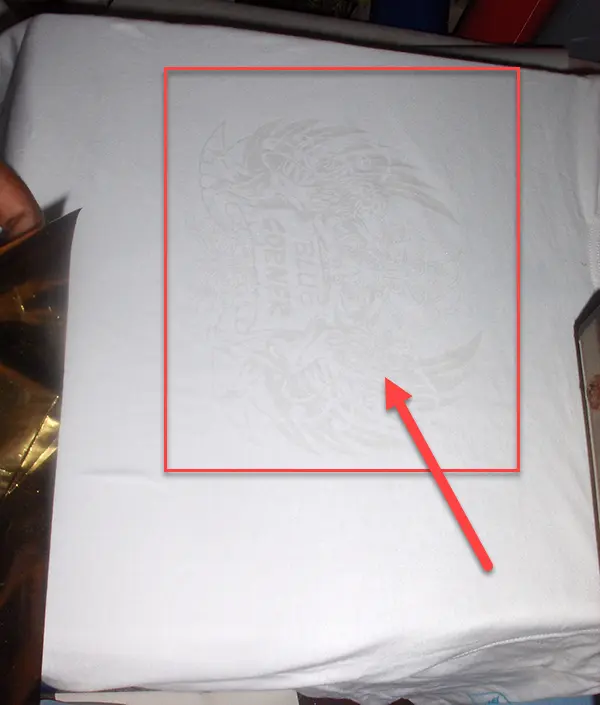Foil Printing Step 2: Transparent Foil Ink on White Garment by ScreenPrintingNow Foil printing step 2: printing transparent foil ink on white garment by ScreenPrintingNow